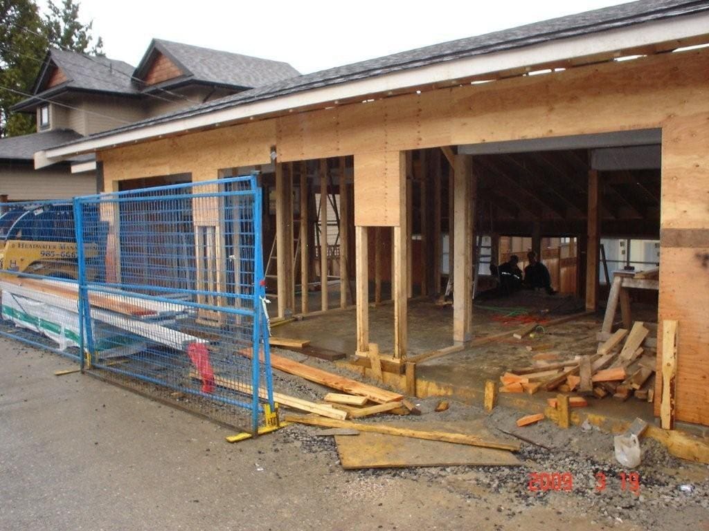 Construction site showing a framed structure in progress